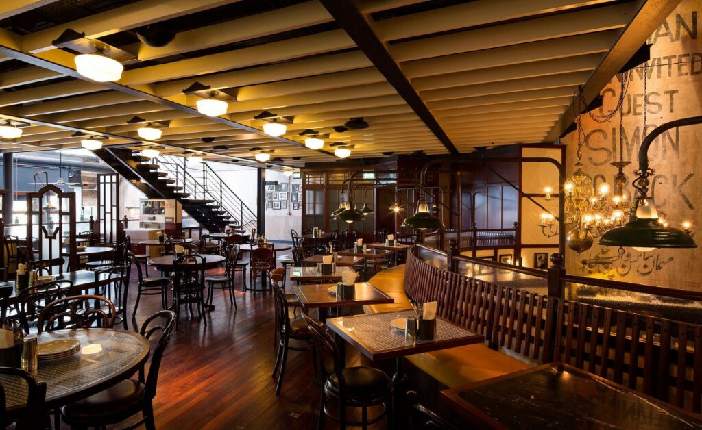 Dishoom: Savor delicious Indian street food in a vibrant setting.